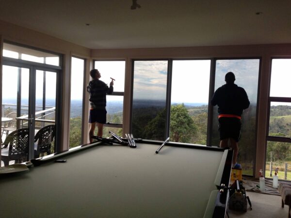 technicians applying window film - window tinting gold coast