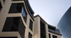 apartment building with black tinted windows